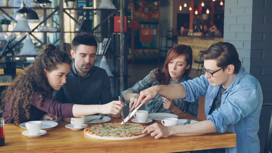 Friends sharing a meal; illustrative experience photography
